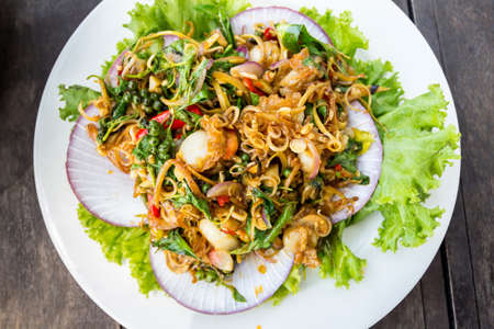 Fried herbal vegetables with scallops.の写真素材