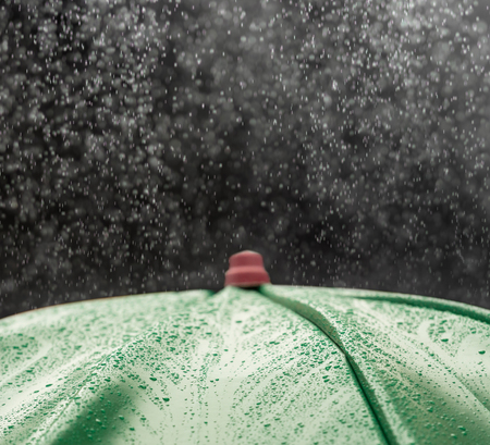 umbrella and rain drops closeupの写真素材