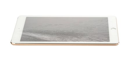 Tablet with broken screen isolate on whiteの写真素材