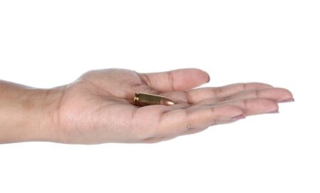 hand with bullet isolated on white background.の写真素材