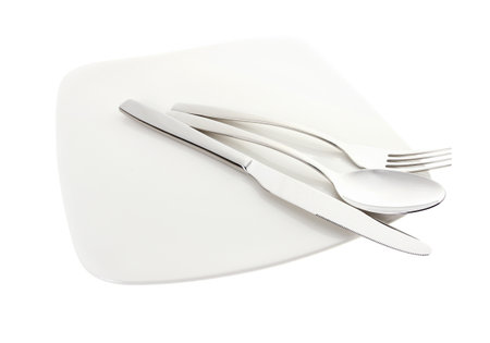 Spoon knife and fork with plateの写真素材