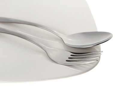 Spoon and fork with plateの写真素材