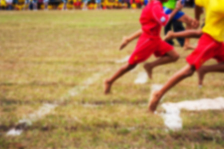 blurry of Men athletes running in the stadium.の写真素材