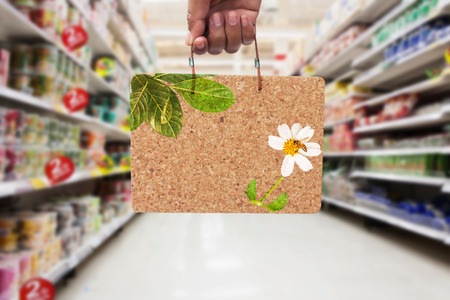 hand hold   brown cork board  information BIG SALE in the supermarketの写真素材