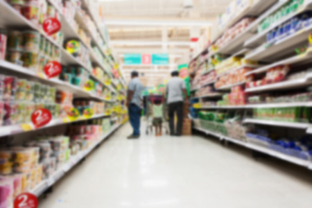blurry of father and son walk shopping in the supermarketの写真素材