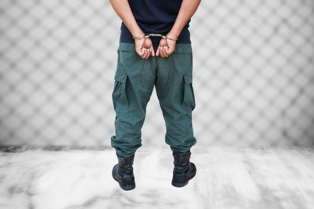 the man was bound by hand in the handcuffed out of freedom