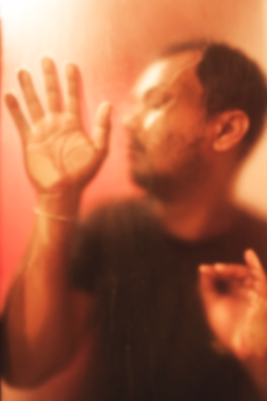 blurry vintage of the man standing behind froste grassの写真素材