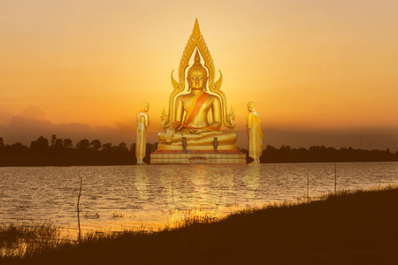 Buddha image on the river sunset in Thailandの写真素材