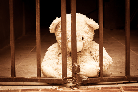 teddy bear in jail vintage toneの写真素材