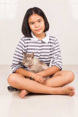 cute girl smile and happy with gray catの写真素材