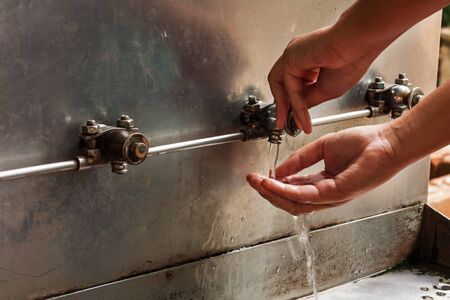 hand girl press the drinking water