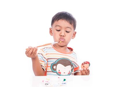 little boy play easter eggの写真素材