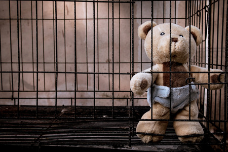 teddy bear in jail vintage toneの写真素材