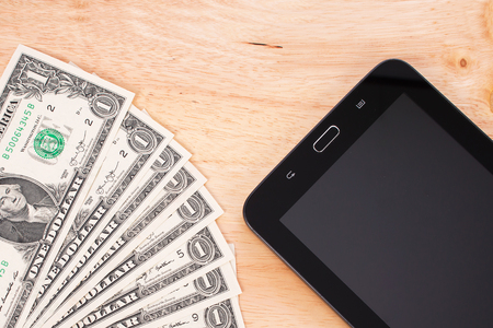 Dollar money on wooden background