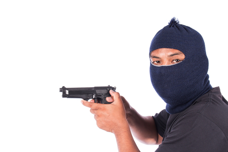 Bandit with gun in handの写真素材