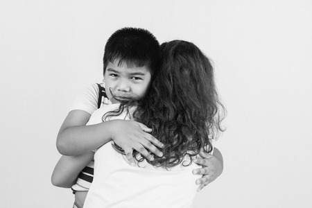 Little boy sad in  hugging of  motherの写真素材