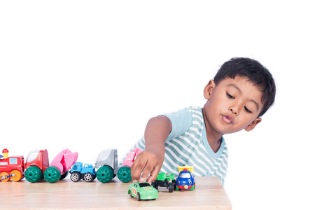 Cute little boy play toy car
