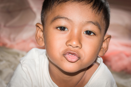 Close up of face child little boy look cameraの写真素材