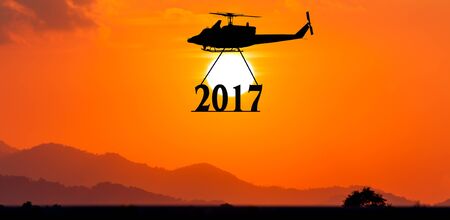 New year 2017 concept ,helicopter take to text 2017 sunset backgrkound