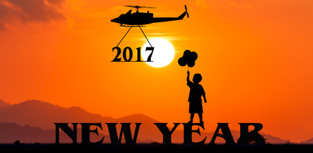 New year 2017 concept ,helicopter take to text 2017 sunset backgrkound