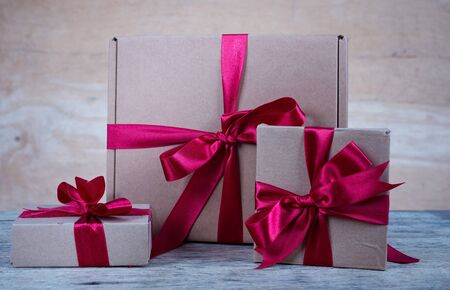 Brown gift box on brown wooden background