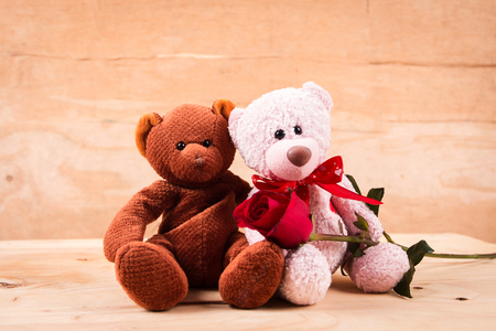 concept valentine day,red rose and test love on brown wooden backgroundの写真素材