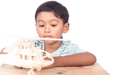 Cute asian boy play plane ,focus handの写真素材