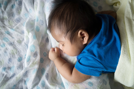 Cute asian baby sleepingの写真素材