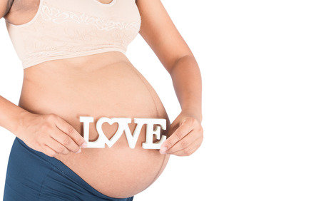 Pregnant woman hold text loveの写真素材