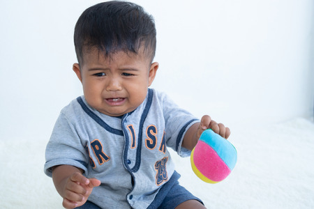 Cute little asian baby boy crying