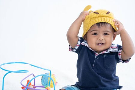 Cute little asian baby boy play toyの写真素材