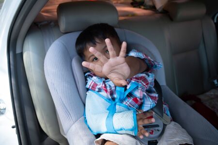 Cute boy hand bone broken from accident with arm splintの写真素材