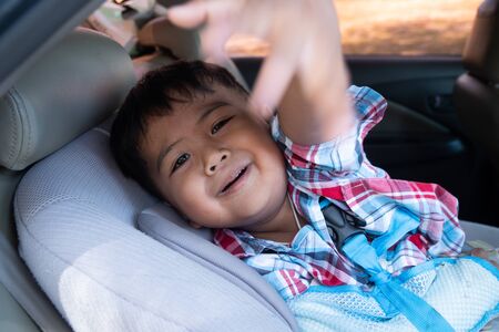 Cute boy hand bone broken from accident with arm splintの写真素材