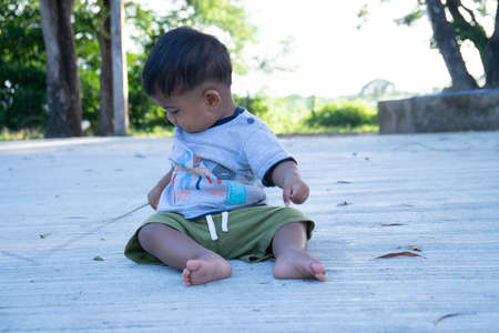 Little baby boy  play stick woodの写真素材