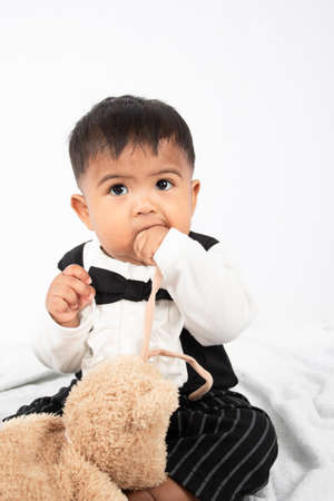 Little baby boy play and bite toyの写真素材