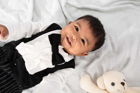 Little baby boy play and bite toyの写真素材