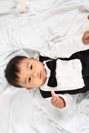 Little baby boy play and bite toyの写真素材