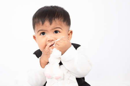 Little baby boy play and bite toyの写真素材