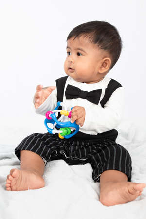 Little baby boy play and bite toyの写真素材