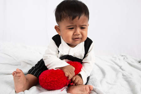 Little baby boy play and bite toyの写真素材