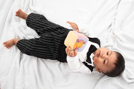 Cute little asian baby boy  play toyの写真素材