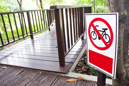 Wood bridge and no bicycle entry signの写真素材