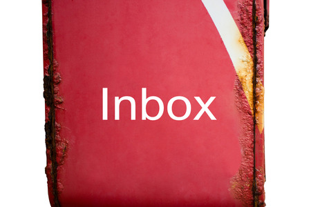 Inbox words on red post box have the rust on white backgroundの写真素材