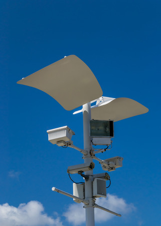 CCTV , Speaker and Sport Light with blue sky backgroundの写真素材