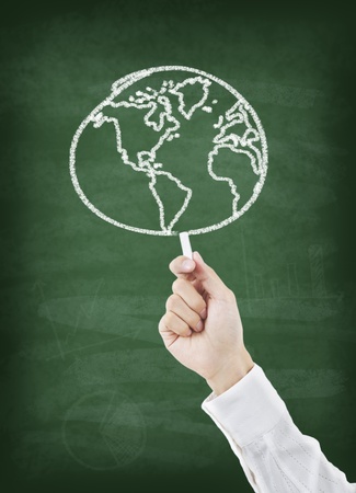 Hand drawing world on greenboardの写真素材