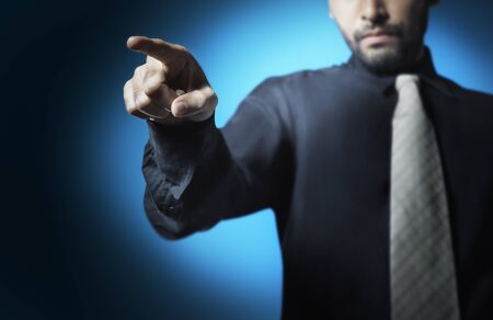 businessman point finger to ordered his teamsの写真素材