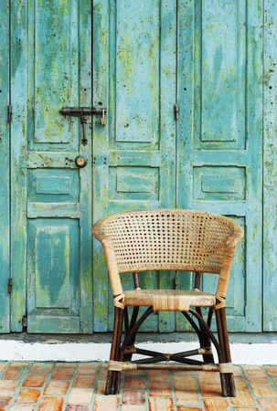 retro door and chair in old townの写真素材