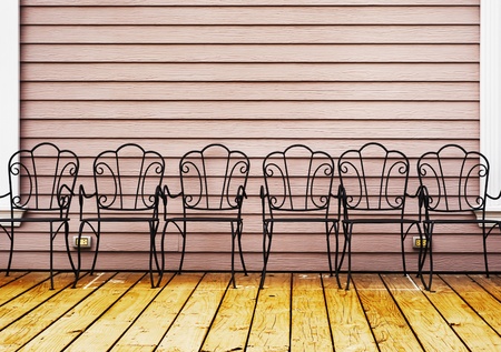 retro chairs on wooden floor and old rose color wallの写真素材