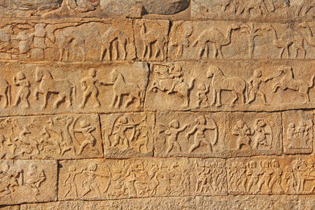 Stone bas-reliefs on the walls in Temples Hampi. Carving stone ancient background.の写真素材