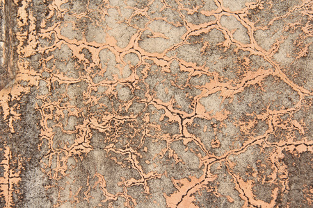 Old flaky paint peeling off grungy cracked wall. Cracks, scrapes, peeling old paint and plaster on...